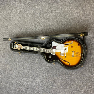 Epiphone Joe Pass Emperor II Vintage Sunburst guitar in case, showcasing its elegant design. Perfect for music enthusiasts seeking quality instruments at Guitars on Main.