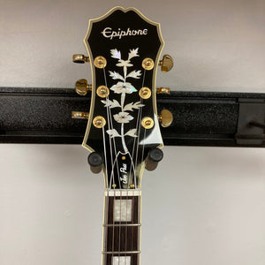 Epiphone Joe Pass Emperor II Vintage Sunburst guitar on a rack, showcasing its detailed strings and body, available used with case at Guitars on Main.