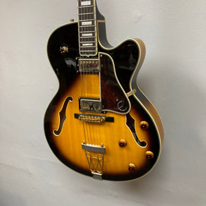 Epiphone Joe Pass Emperor II Vintage Sunburst guitar displayed on wall, highlighting its elegant design and craftsmanship, available used with case at Guitars on Main.