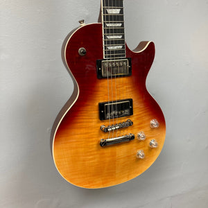 Epiphone Les Paul Modern Figured Magma Orange Fade, showcasing its detailed maple top, mahogany body, and dual ProBucker pickups.