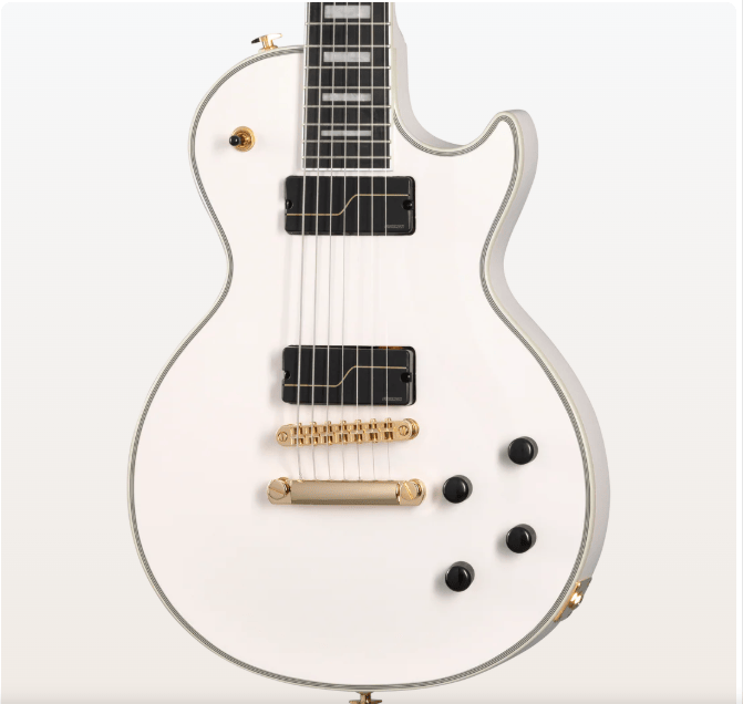 A close-up of an Epiphone Matt Heafy Les Paul Custom Origins electric guitar in Bone White, featuring gold hardware, Fishman Fluence pickups, three black knobs, a toggle switch, inlaid fretboard, single cutaway body, and glossy finish.
