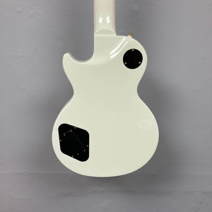 Back view of the Epiphone Matt Heafy Les Paul Custom Origins 7-string in Bone White, showing two black plastic covers with gold screws, set against a plain gray wall.