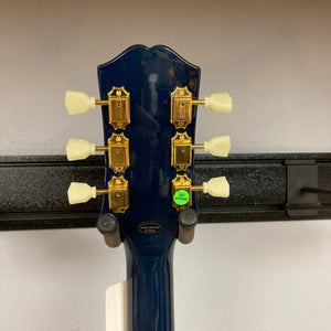 Epiphone Miranda Lambert Bluebird Studio - Bluebonnet guitar close-up, showcasing tortoise pickguard with bluebird graphic and gold tuning machines.