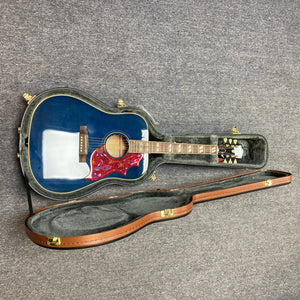 Epiphone Miranda Lambert Bluebird Studio - Bluebonnet guitar in a hardshell case, showcasing its solid spruce top and hummingbird-style pickguard.