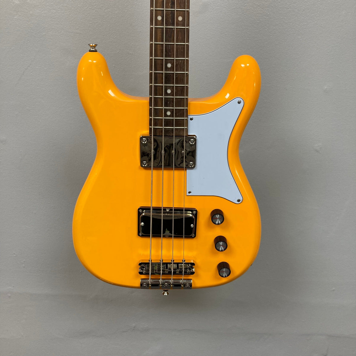 Epiphone Newport Bass California Coral, vintage-style yellow electric bass guitar with a unique body shape and humbucker pickups.