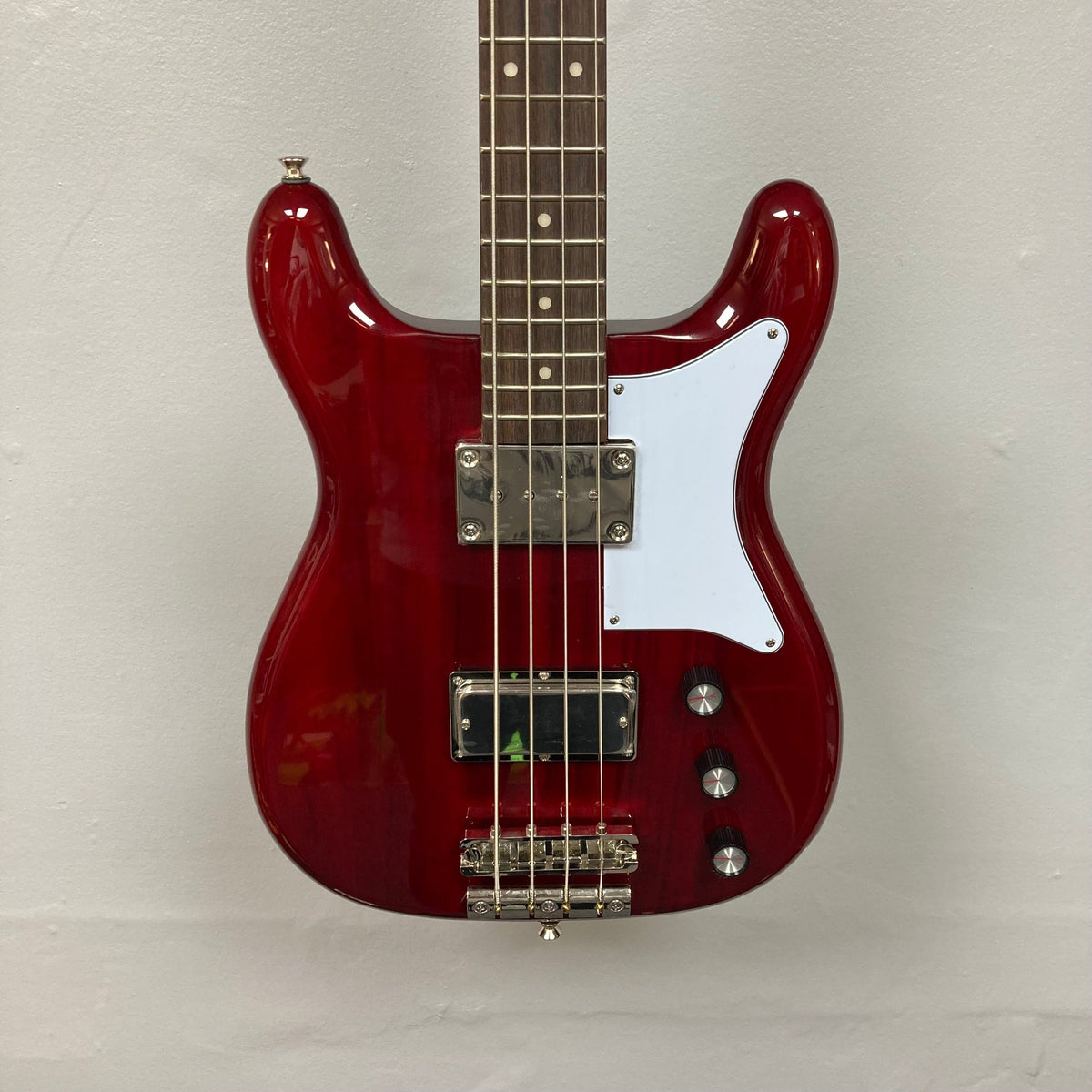 Epiphone Newport Bass Cherry, a red electric bass guitar with a vintage body shape and four strings, featuring mahogany construction and dual humbuckers.