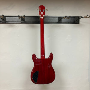 Epiphone Newport Bass Cherry, a vintage-style electric bass guitar with a distinctive body shape, mahogany construction, and modern pickup controls.