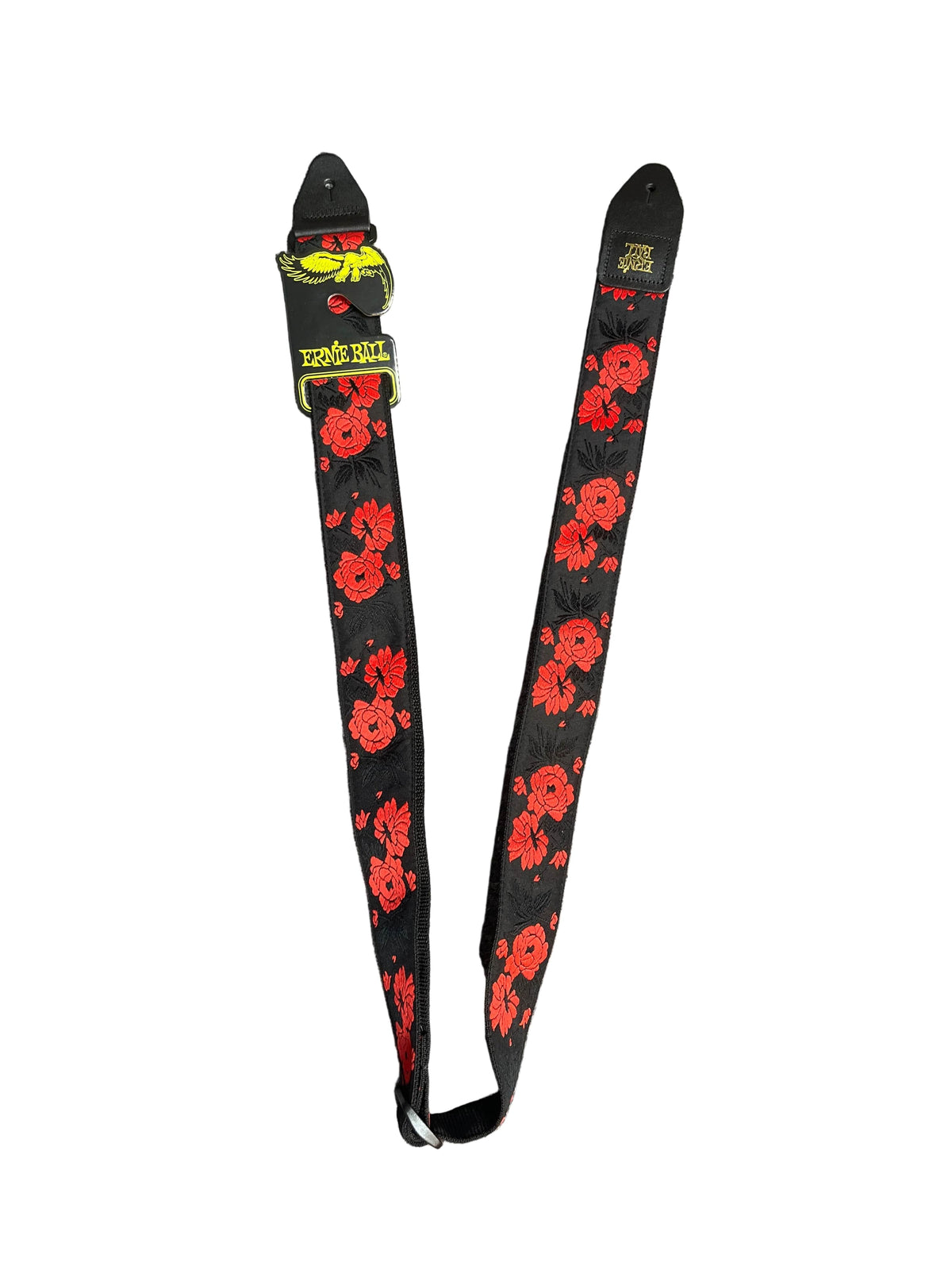 The Ernie Ball Classic Jacquard Guitar Strap/Bass Strap - Tango Rose features a red rose-inspired floral pattern and a green embroidered lizard, set on a black strap with white background accents.