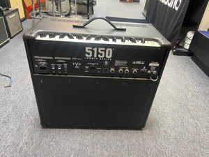 The EVH 5150® Iconic® Series 6L6 40W 1x12 Combo used/consign tube amplifier by EVH is shown from the back in a showroom, displaying its ports, control knobs, carry handle on top, and resting on a carpeted floor.