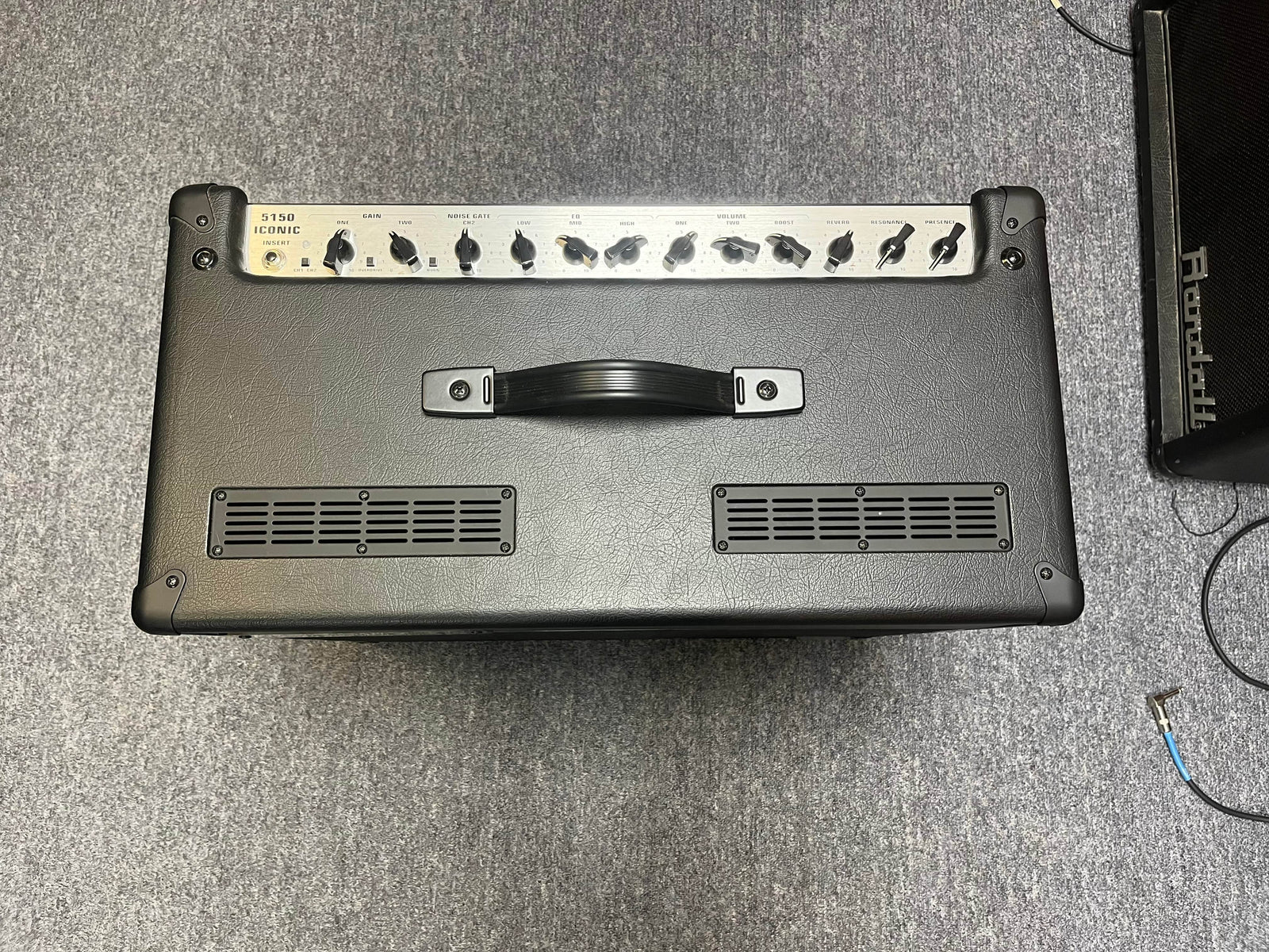 A used EVH 5150® Iconic® Series 6L6 40W 1x12 Combo tube guitar amp, black with a top handle, control knobs on the top panel, and "5150" logo on the upper left front grille, shown against a white background.