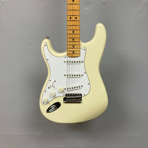 Fender Artist Series Jimi Hendrix Tribute Stratocaster USA 1997, pristine white electric guitar with brown knobs, close-up on neck and bridge, includes original case.