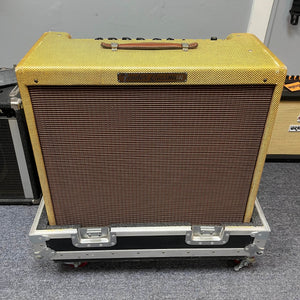 A 1957 Fender Bassman 5F6 Narrow Panel 40-Watt 4x10" Guitar Combo w/Flight Case sits on a gray carpeted floor.