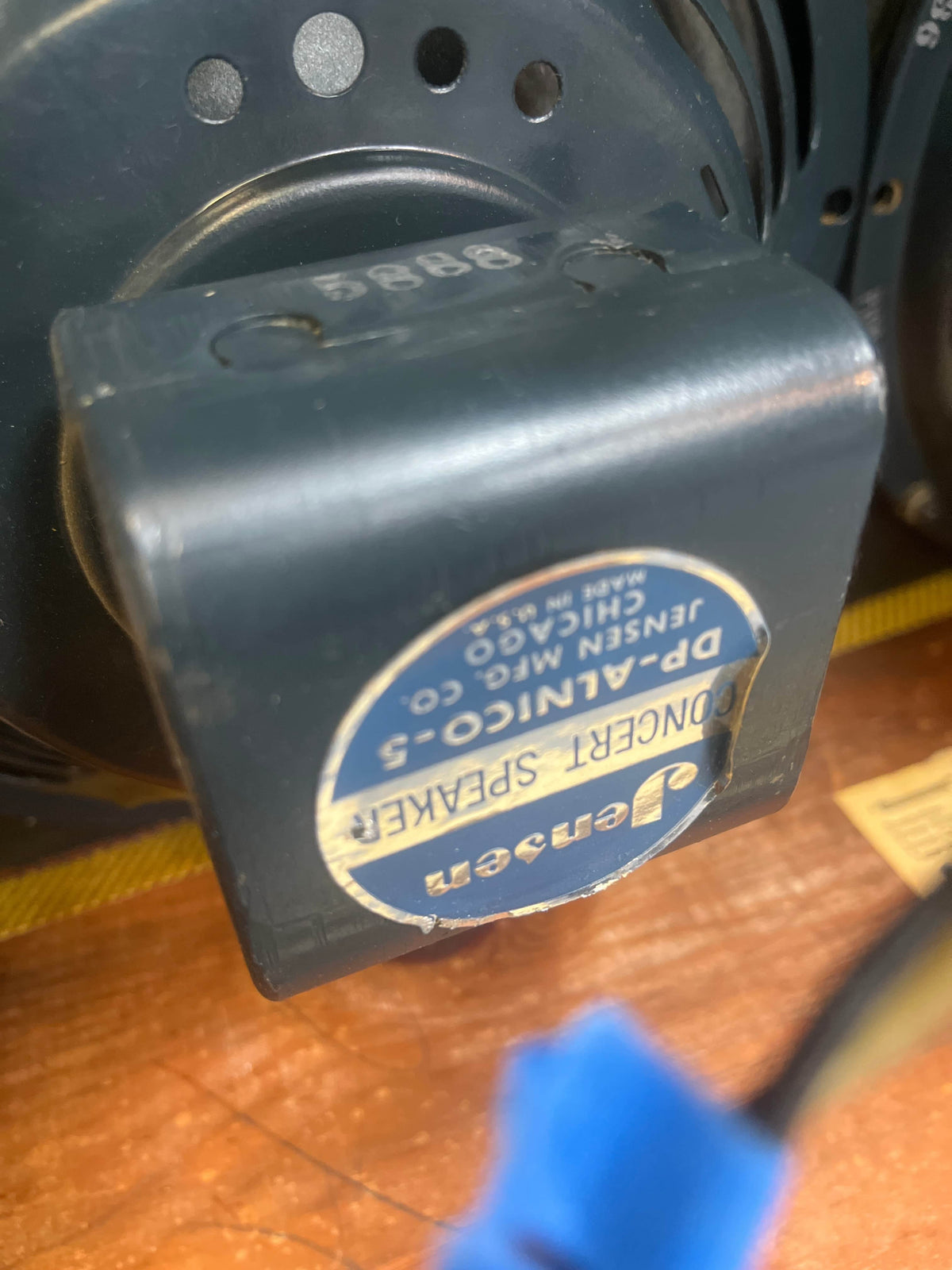 Close-up of a Jensen P12Q speaker in a 1957 Fender Bassman 5F6 Narrow Panel 40-Watt 4x10" Guitar Combo, showing the "Jensen Special Design, Model P12Q, Made in Chicago, U.S.A." label on the magnet.