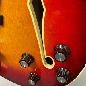 Close-up of a Fender Coronado II 1973 Sunburst guitar, highlighting its semi-hollow body, dual Fideli'Tron humbuckers, and detailed craftsmanship.