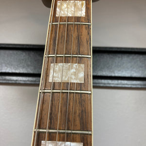 Close-up of Fender Coronado II 1973 Sunburst guitar neck and strings, highlighting its signature design and craftsmanship.