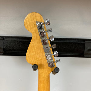 Fender Coronado II 1973 Sunburst w/Case showing a close-up of the guitar neck with silver pegs, reflecting its vintage design and craftsmanship.