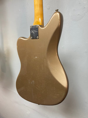 Fender Custom Shop Jaguar Journeyman electric guitar displayed on a white wall.