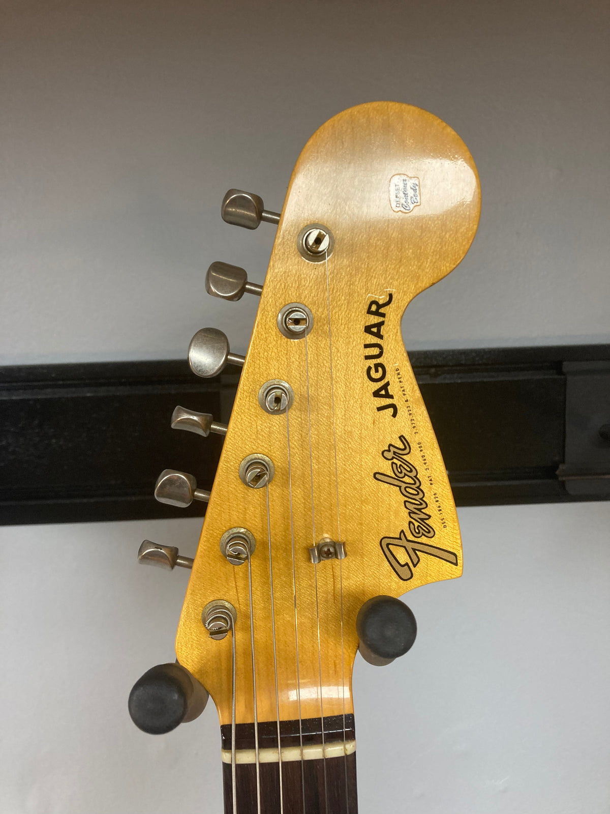 Close-up of a Fender Custom Shop Jaguar Journeyman guitar, showcasing strings and craftsmanship details.