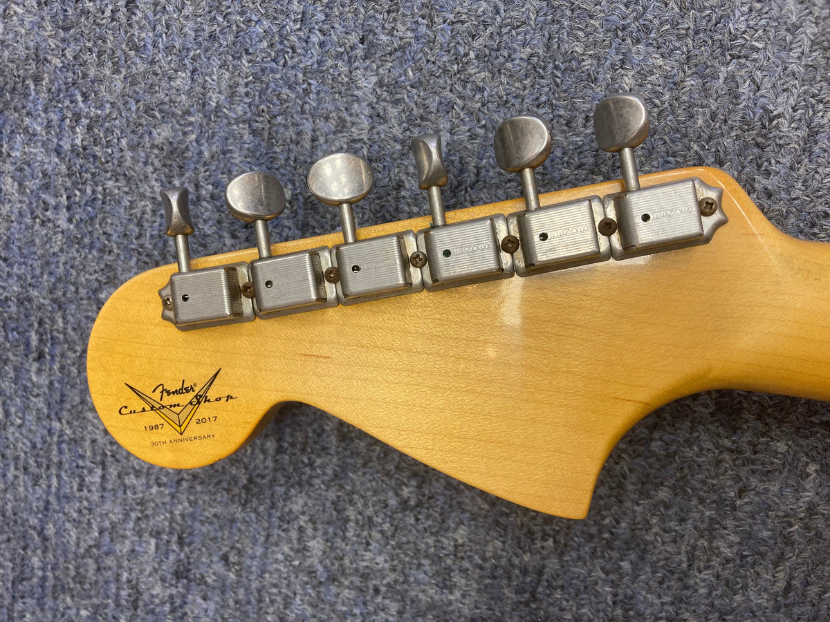 Close-up of the Fender Custom Shop Jaguar Journeyman guitar&#39;s neck and strings, highlighting its detailed craftsmanship and limited-edition authenticity.