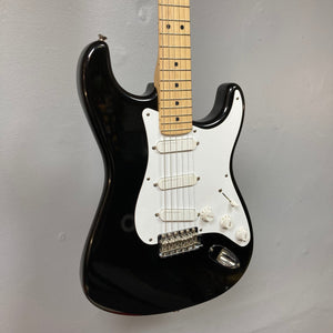 Fender Eric Clapton Artist Series Stratocaster USA 2001 electric guitar, black and white, with original case, showcasing fine craftsmanship and pristine condition.