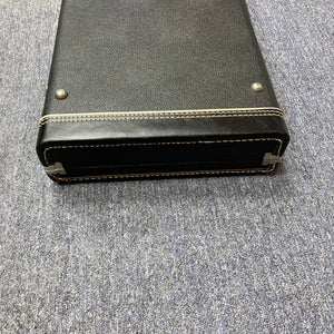 Vintage Fender Guitar Case, genuine from late '60s to early '70s, black leather with stitching, shown on carpet. Ideal for collectors and musicians.