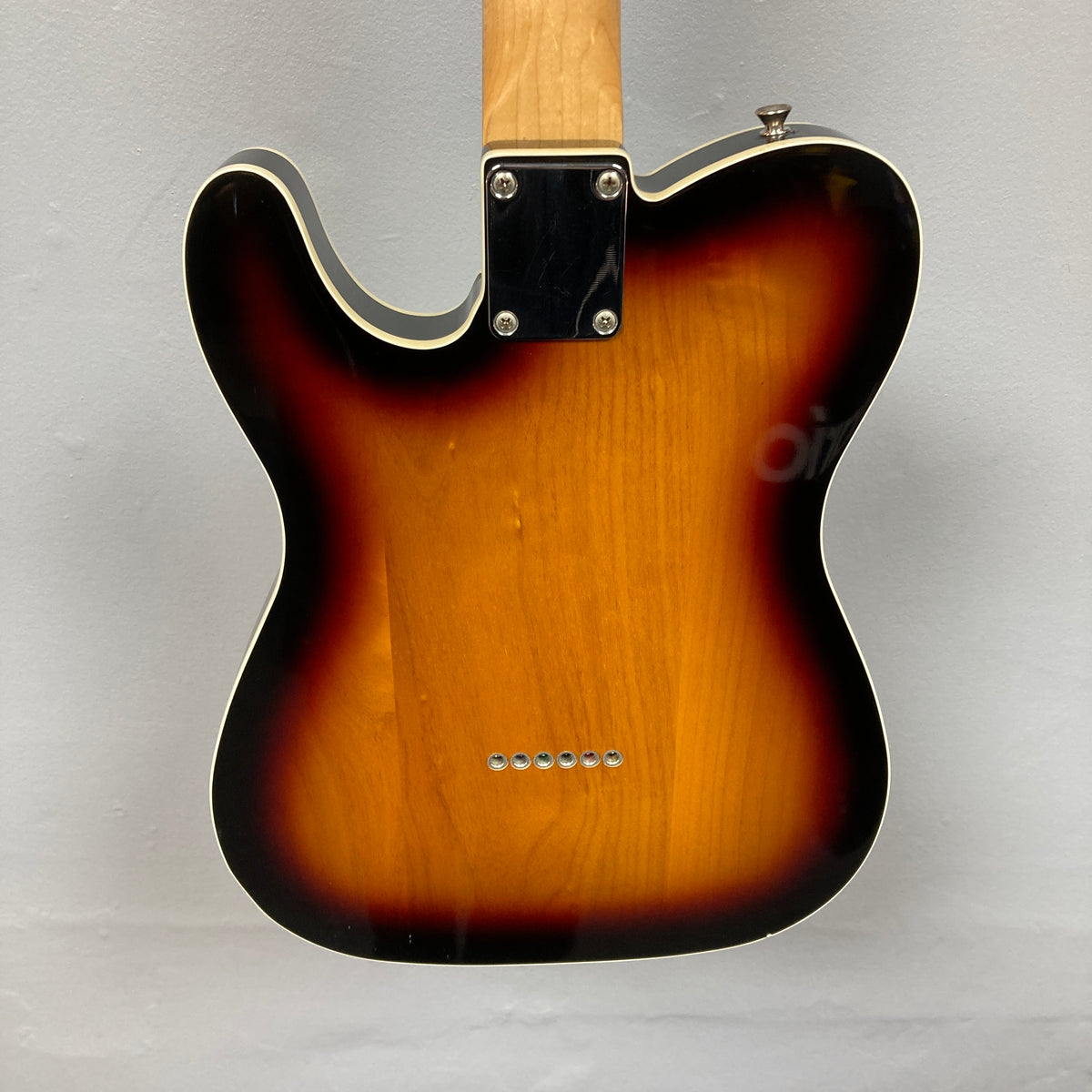 Rear view of the Fender Heritage '60s Telecaster Custom Made in Japan Sunburst w/Gigbag Consign, featuring a classic sunburst body, light wood neck, six string holes, and metal neck plate—timeless Fender style on a light gray background.