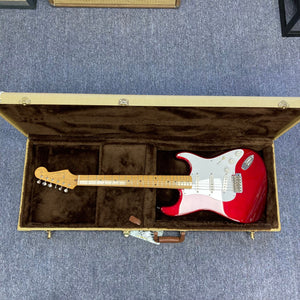 Fender Japan Stratocaster Candy Apple Red 2004 in case, electric guitar with iconic design and craftsmanship.