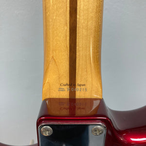 Fender Japan Stratocaster Candy Apple Red 2004, close-up of the guitar neck and headstock, showcasing its fine craftsmanship with original case included.