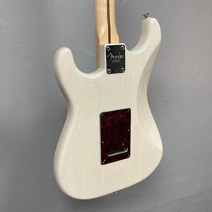 Rear view of a Fender Limited Edition Ash American Professional Stratocaster in White Blonde, showing the back plate, neck joint, and part of the channel-bound neck. Includes case.