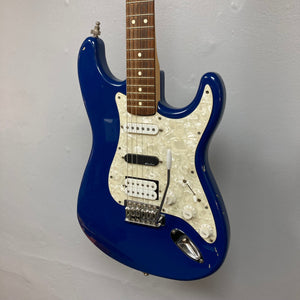 Fender MIM Stratocaster Blue 1998, showing a blue and white electric guitar with classic Stratocaster design and versatile pickups, used condition with finish blemishes.