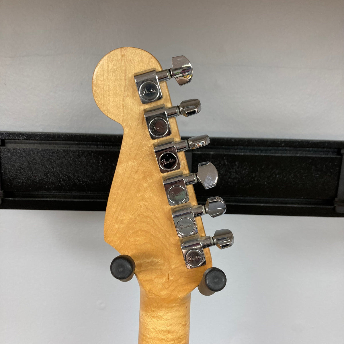 Fender MIM Stratocaster Blue 1998 close-up showing neck, headstock, and pickups with visible wear, highlighting its well-used condition and classic design.