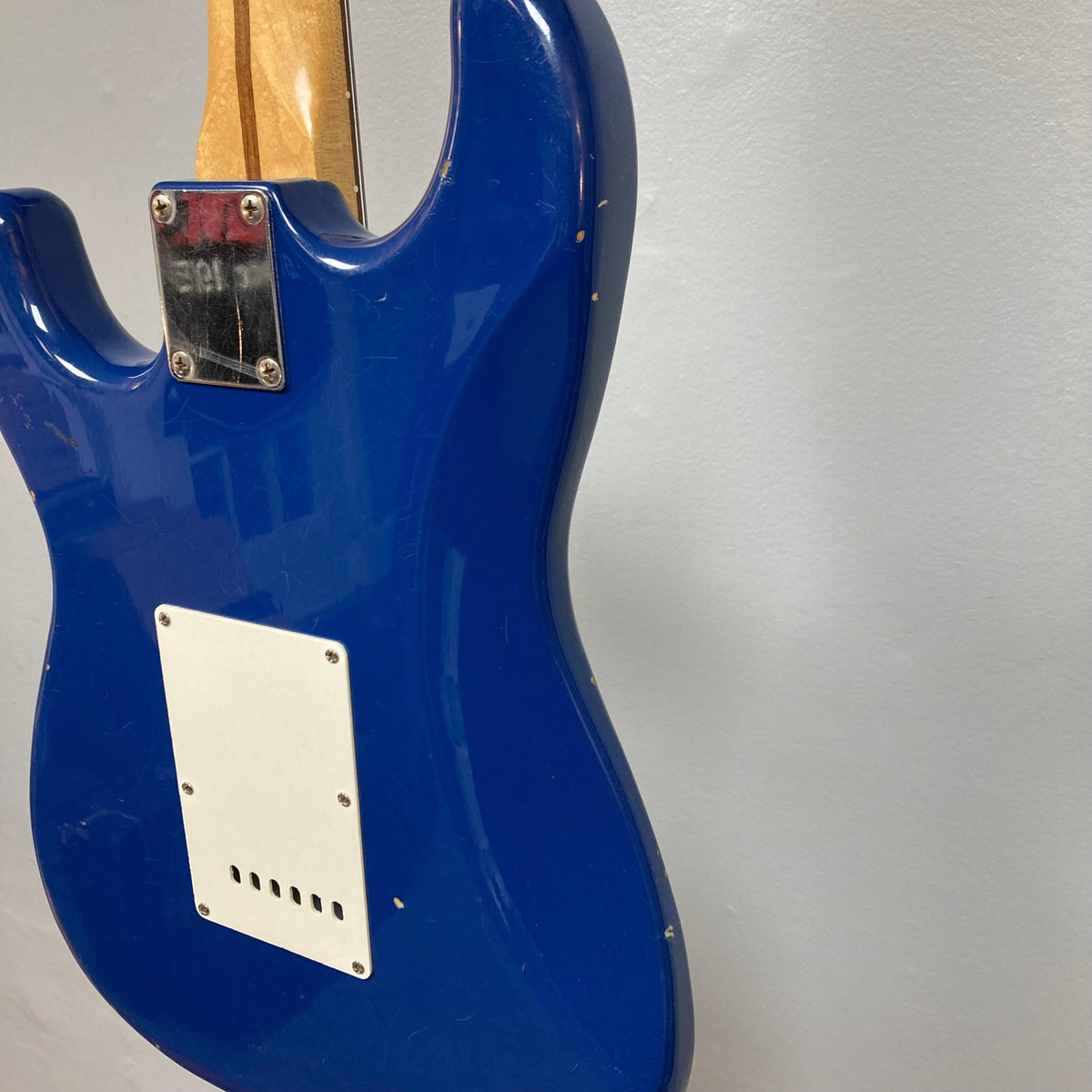 Fender MIM Stratocaster Blue 1998, well-used electric guitar, featuring a versatile pickup configuration, classic controls, and visible finish blemishes.