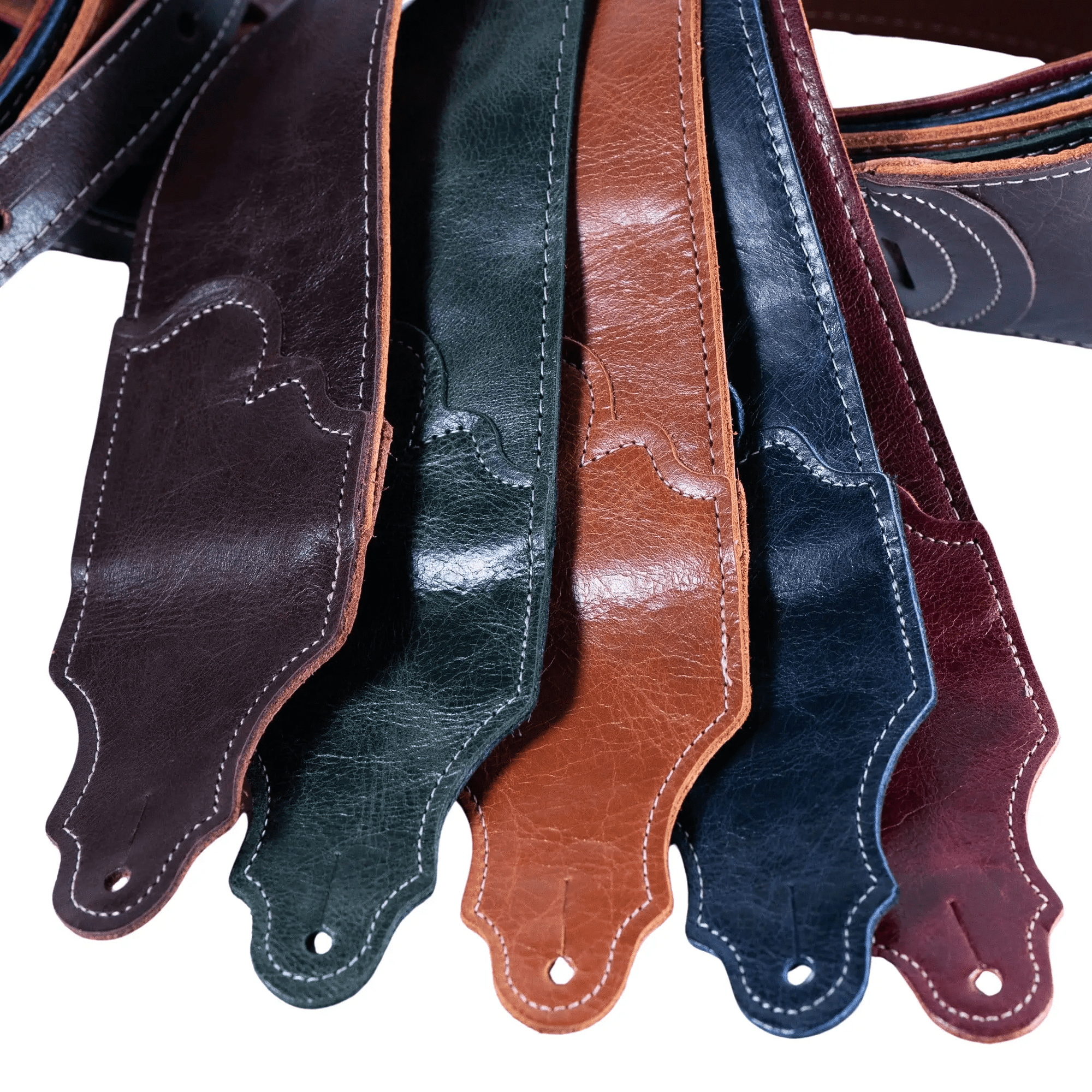 Franklin Jackson Hole Aged Leather Guitar Strap featuring detailed stitching, showcasing a group of elegant leather straps for guitar enthusiasts.