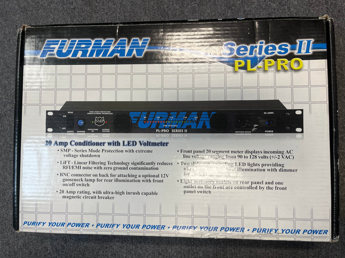 A Furman PL-Pro II Series II Power Conditioner with LED Voltmeter (Used – Like New) box features blue Furman branding, technical specs, and highlights a 20-amp power conditioner and LED voltmeter on a grid-patterned background.