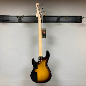 A G&L L-2000 USA Tobacco Sunburst Bass w/Case (used, consignment) by G&L is shown hanging on a wall rack, displayed from the back with its tag attached to the headstock.