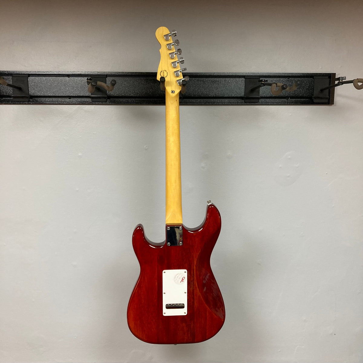 G&amp;L Tribute Series S-500 Irish Ale Electric Guitar with MFD pickups on a wall hook.