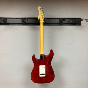 G&L Tribute Series S-500 Irish Ale Electric Guitar with MFD pickups on a wall hook.