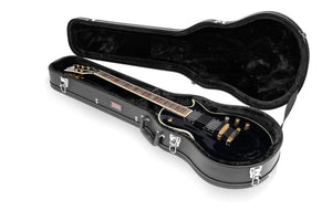 Gator Economy Wood Case for Les Paul LP Electric Guitar, featuring a black guitar inside with plush lining and built-in storage for accessories, ensuring secure transport.