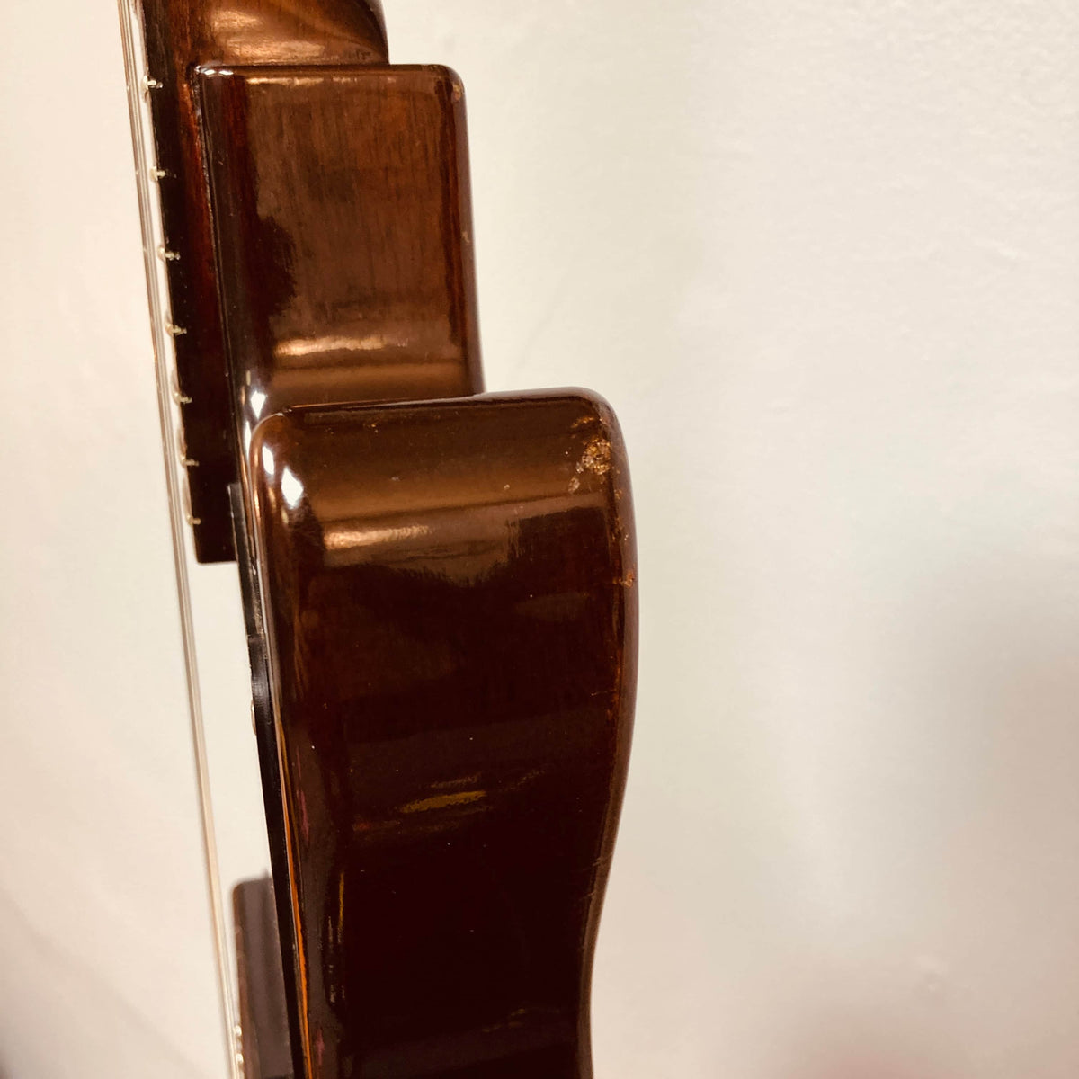 Close-up side view of a Gibson Les Paul Junior 1957 Sunburst electric guitar, showing the neck and body against a plain white background.