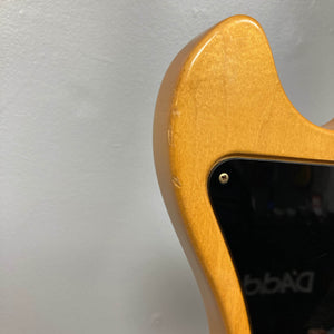 Close-up of the back upper edge of a Gibson RD Artist 1977 - 1982 w/Case from Guitars on Main, featuring a black plastic plate and visible scuff marks that highlight the character of this vintage collectible electric guitar.