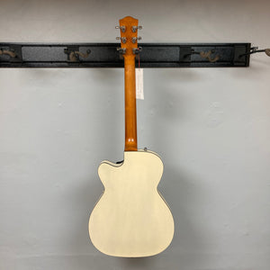 Godin 5th Ave TL Kingpin P90 guitar mounted on a wall, showcasing its hollow body design and craftsmanship from the Montreal and 5th Avenue lines.