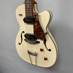 Godin 5th Ave TL Kingpin P90 Trans Cream HG guitar with brown accents, showcasing its distinctive hollow body and tonal versatility.