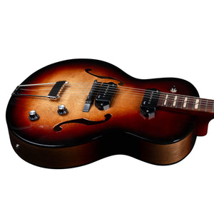 The Godin 5th Avenue Kingpin II DLX Vintage Burst HG SF is a semi-hollow electric guitar with f-holes, two control knobs, a bridge, and P90 pickups—shown from an angled side view—featuring signature Canadian craftsmanship.