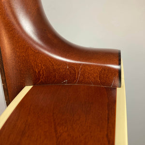 Close-up of the heel joint on the Godin 5th Avenue Kingpin P90 Cognac Burst SF, highlighting its glossy finish and rich wood grain that evoke vintage tone and a smooth neck-to-body transition.