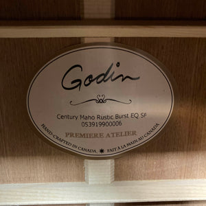 The Godin label inside the body clearly presents the model name “Godin Century Maho Rustic Burst EQ SF,” along with its unique serial number and the phrase “Hand-crafted in Canada” in both English and French. As a dreadnought acoustic electric made from solid wood, this guitar exemplifies Godin’s dedication to quality and expert craftsmanship.