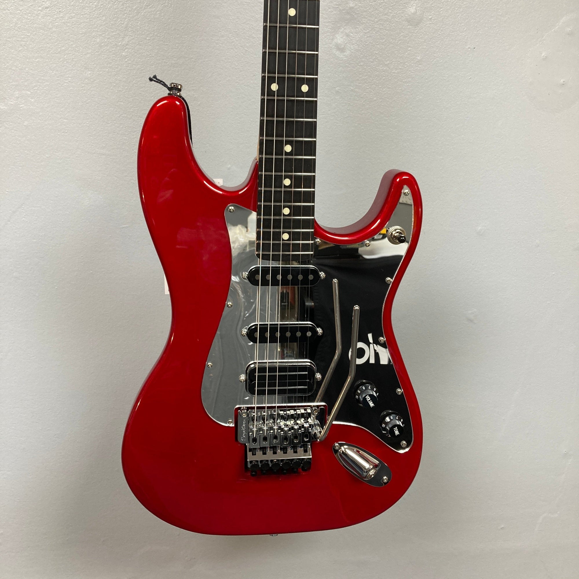 Godin LERXST Grace Red LTD I w/Floyd Rose, showcasing Alex Lifeson’s signature style with a contoured body and advanced tremolo system for versatile play.