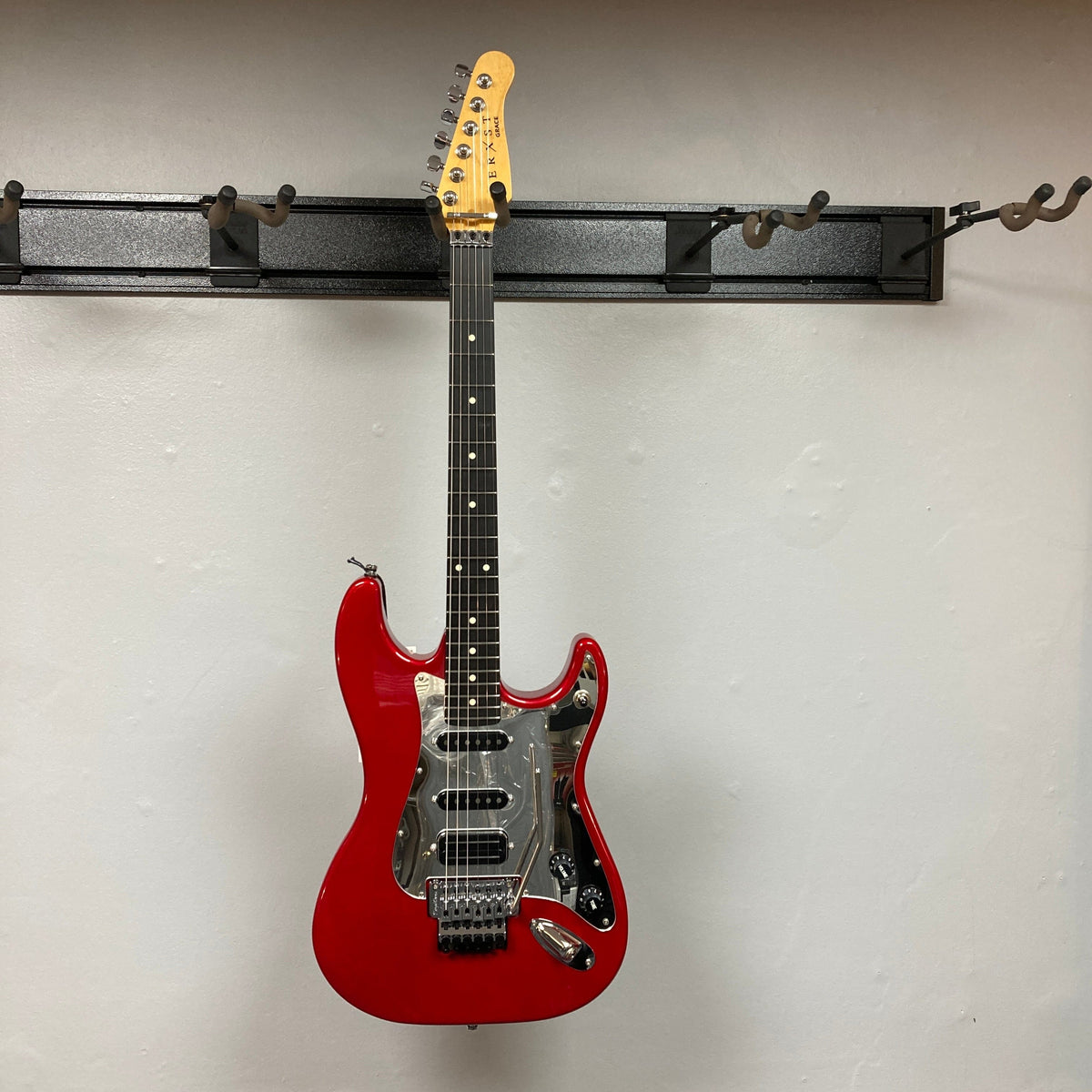 Godin LERXST Grace Red LTD I w/Floyd Rose electric guitar on display, showcasing its sleek design and premium components for discerning musicians.