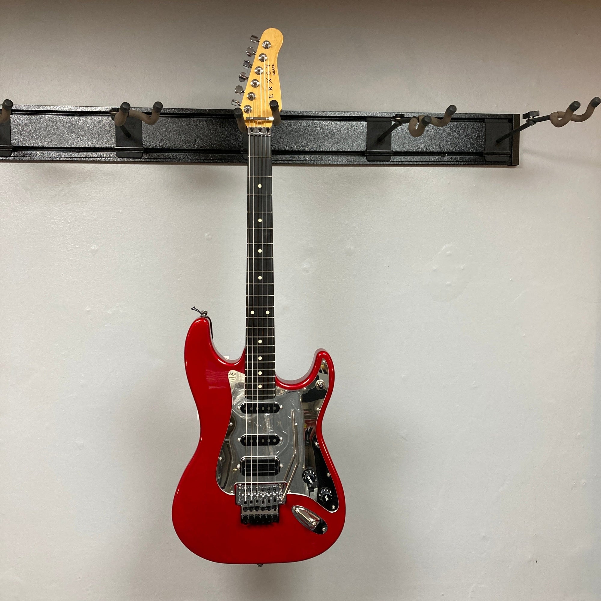 Godin LERXST Grace Red LTD I w/Floyd Rose, showcasing Alex Lifeson’s signature style with a contoured body and advanced tremolo system for versatile play.