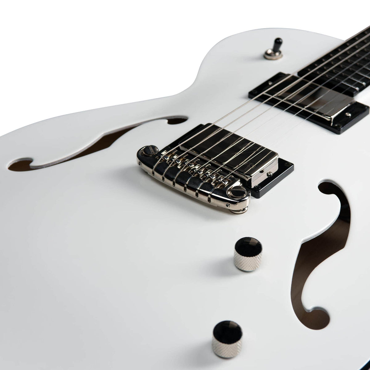 Close-up of a white Godin Rik Emmett Premiere Electric Guitar body by Godin, highlighting the f-holes, bridge, pickup, control knobs, and a portion of the fretboard on this limited edition model.