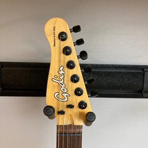 Godin Session R-HT Pro Retro Orange Open Box guitar neck with black knobs and tuning pegs, showcasing precision craftsmanship and high-quality components.